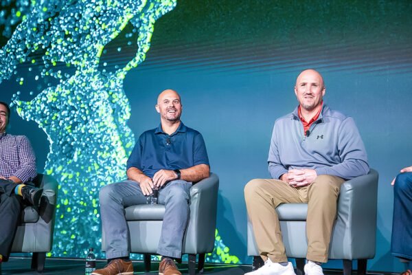 Executive panel seated on stage at GE Verona corporate event in Arizona