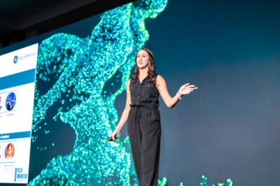 A keynote speaker engaging the audience at the GE Verona corporate conference near Scottsdale, photographed for marketing and internal communications.